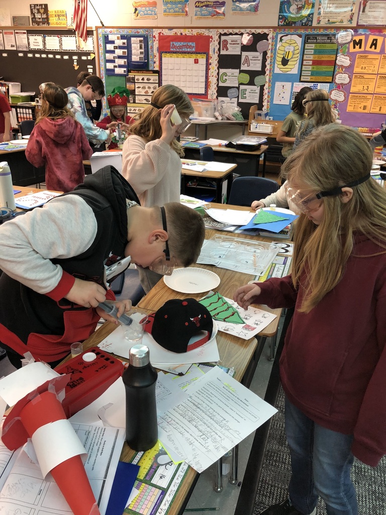 students completing a science experiment