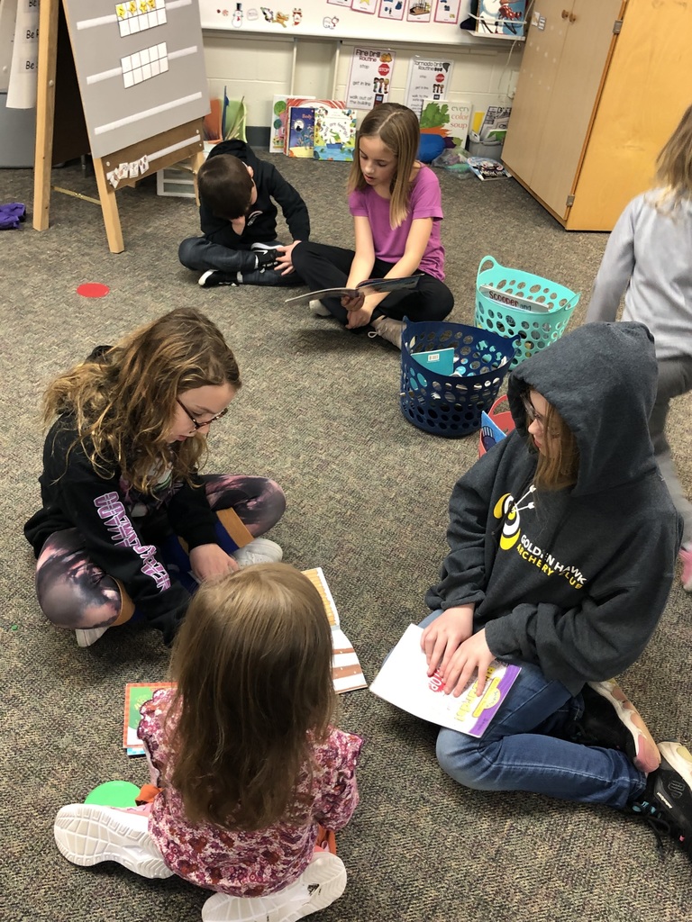 Mid-Prairie West students peer reading with younger students