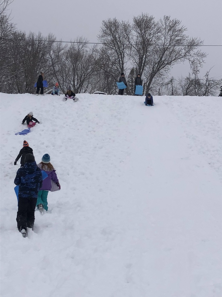 Students sledding at Mid-Prairie West recess
