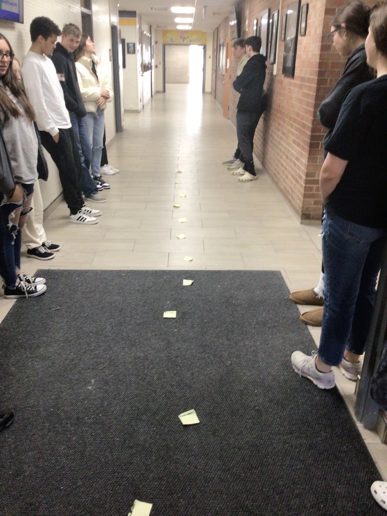 Mid-Prairie Geometry students creating a perpendicular bisector in the hall