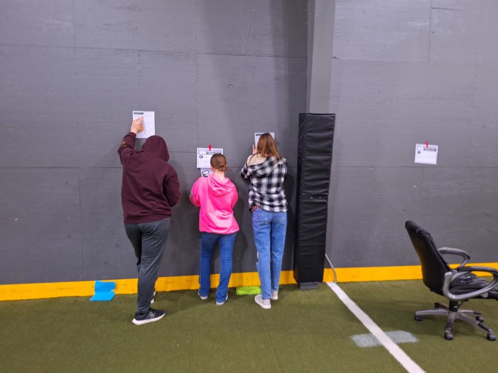 Students working through algebra equations at the Mid-Prairie indoor facility