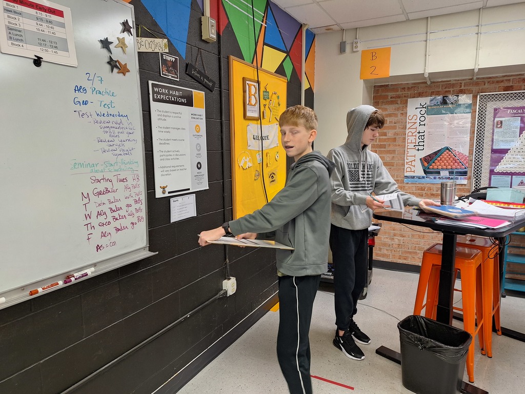 Algebra students working through game-style equations