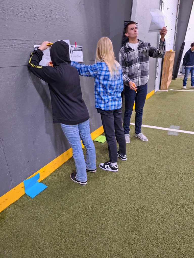 Students working through algebra equations at the Mid-Prairie indoor facility