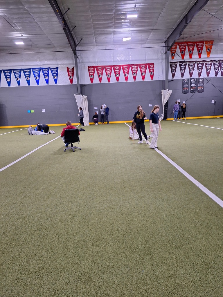 Students working through algebra equations at the Mid-Prairie indoor facility