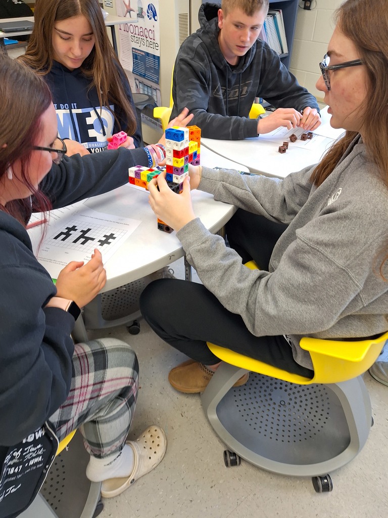Students building 3D cube animals