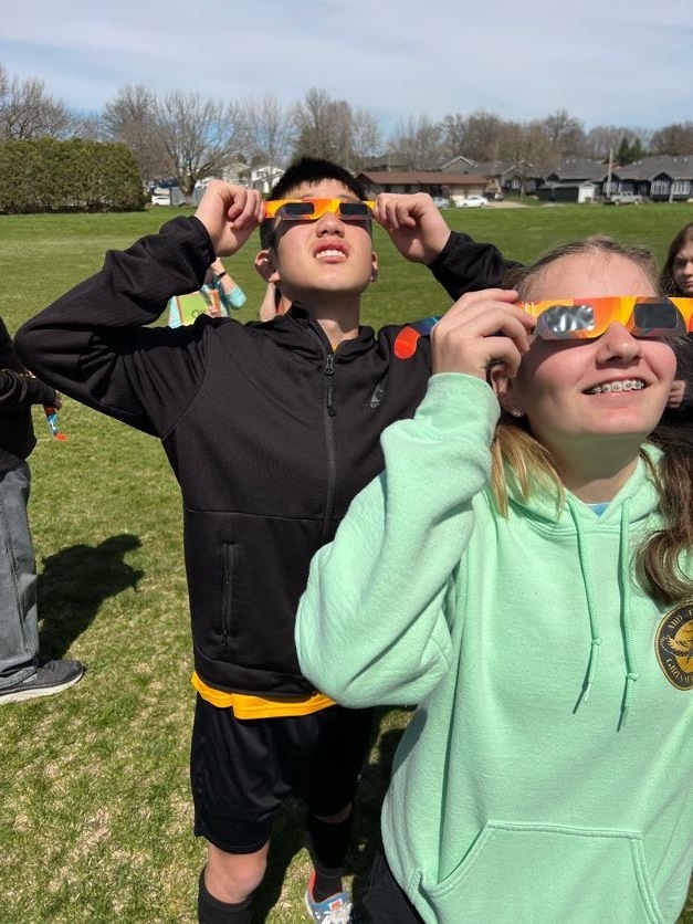 Students using eclipse classes to look at 4/8/24 eclipse
