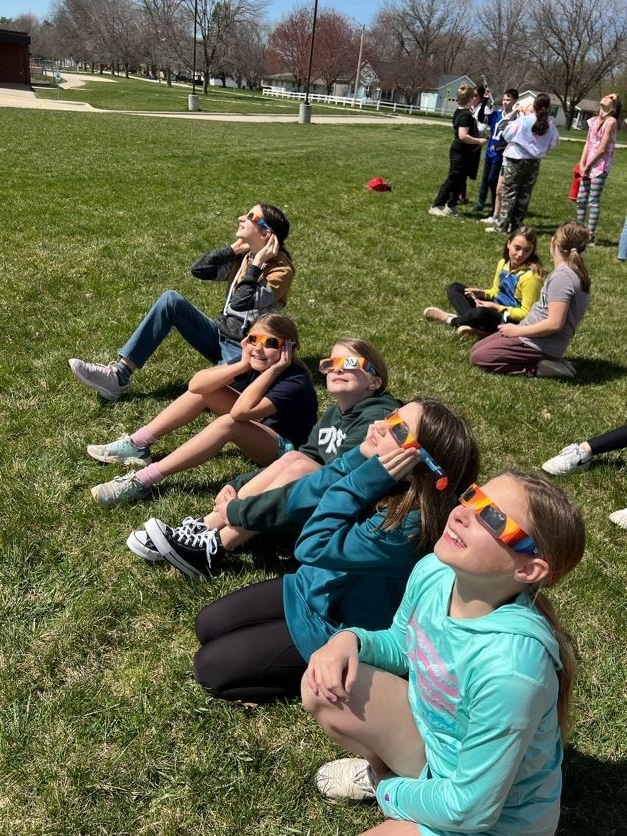 Students using eclipse classes to look at 4/8/24 eclipse