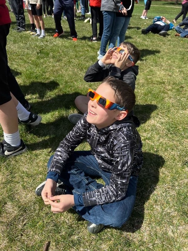 Students using eclipse classes to look at 4/8/24 eclipse