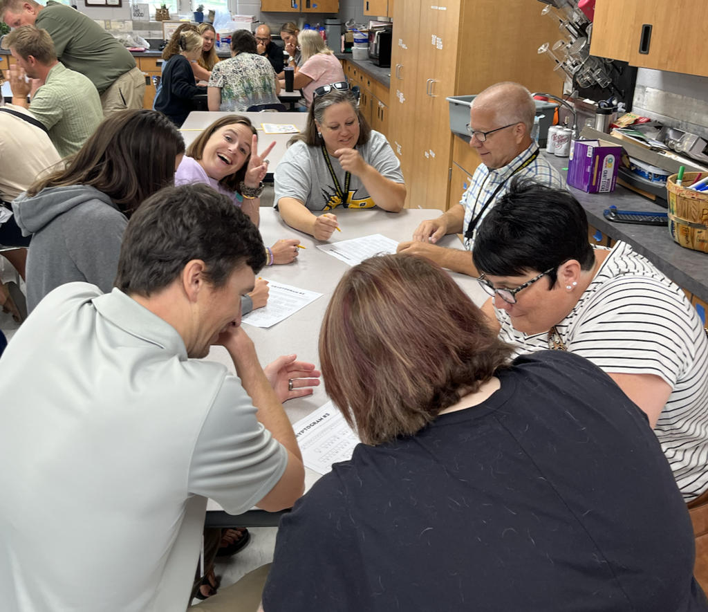 Teams working on solving a coded message