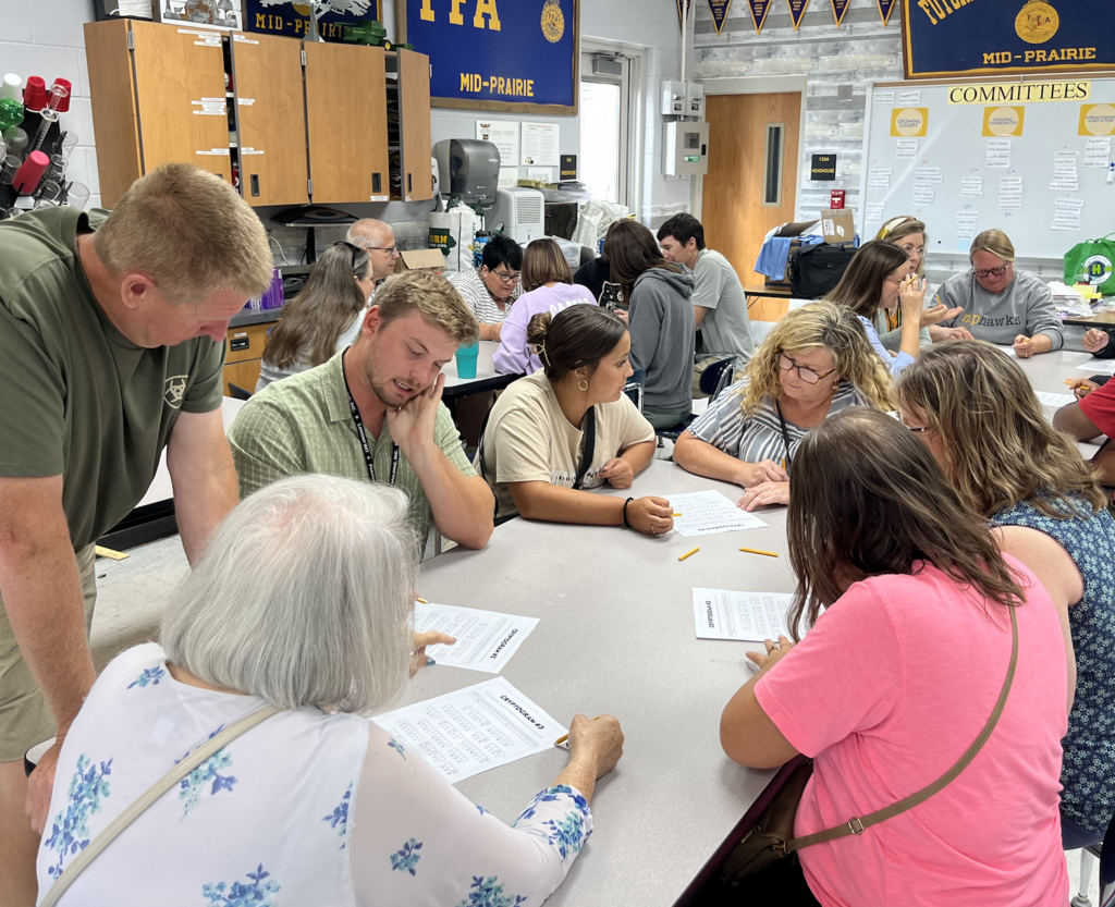 Teams working on solving a coded message