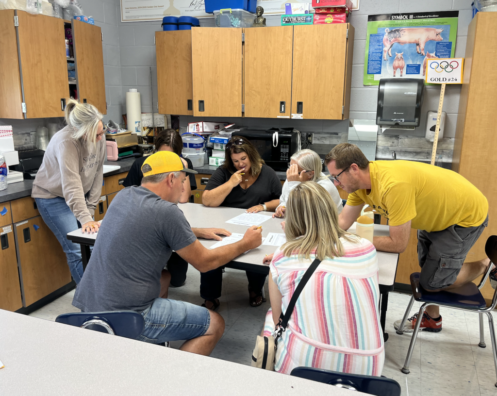 Teams working on solving a coded message