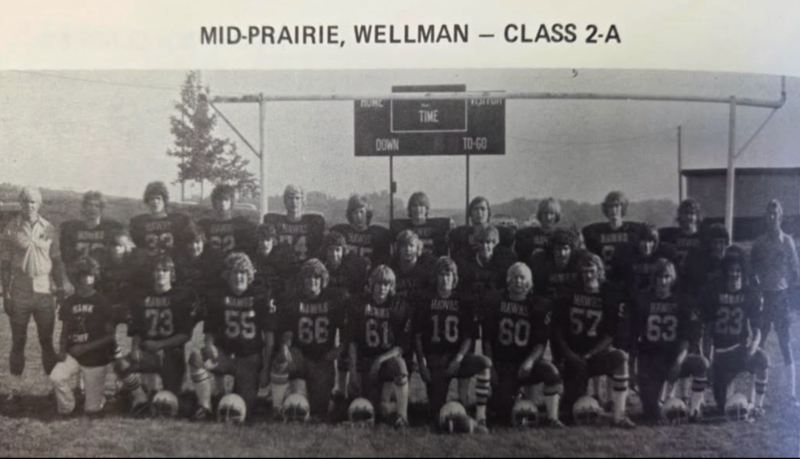 Mid-Prairie 1976 Football team players and coaches in a group photo on the football field