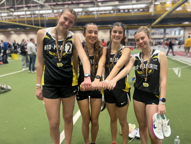 MP girls track 4 relay team members posing with the baton