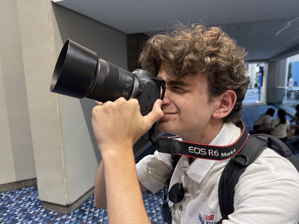 Brandon Krauss moving through his camera taking a photo