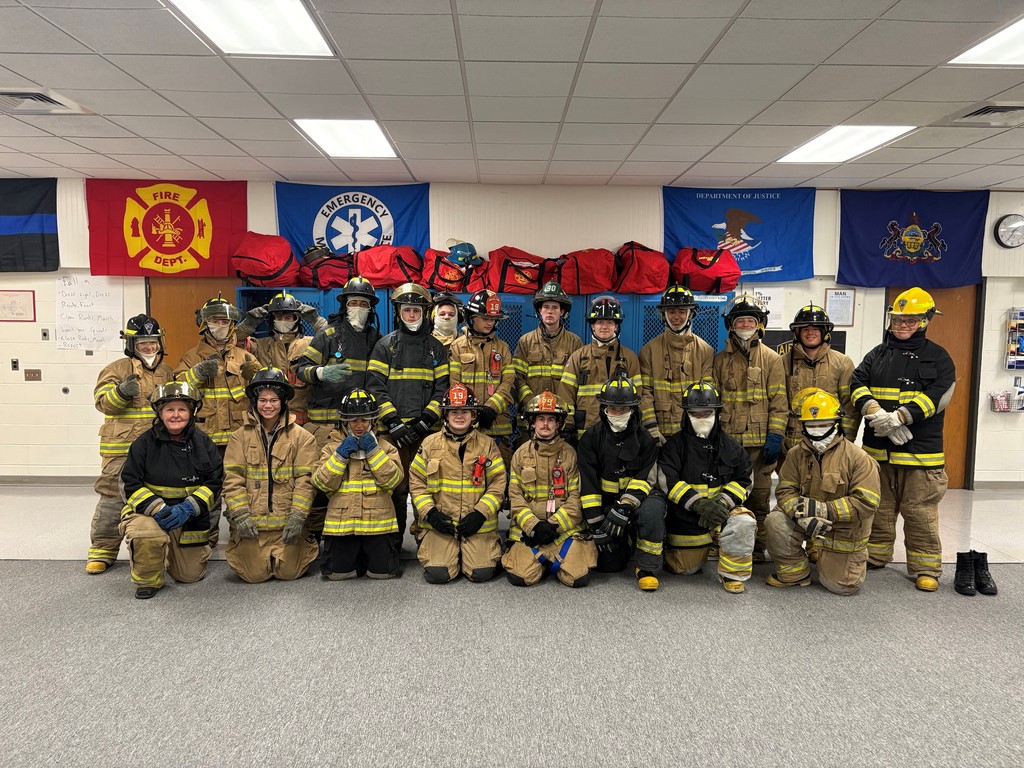 a large group photo of the public safety students all in their fire training
