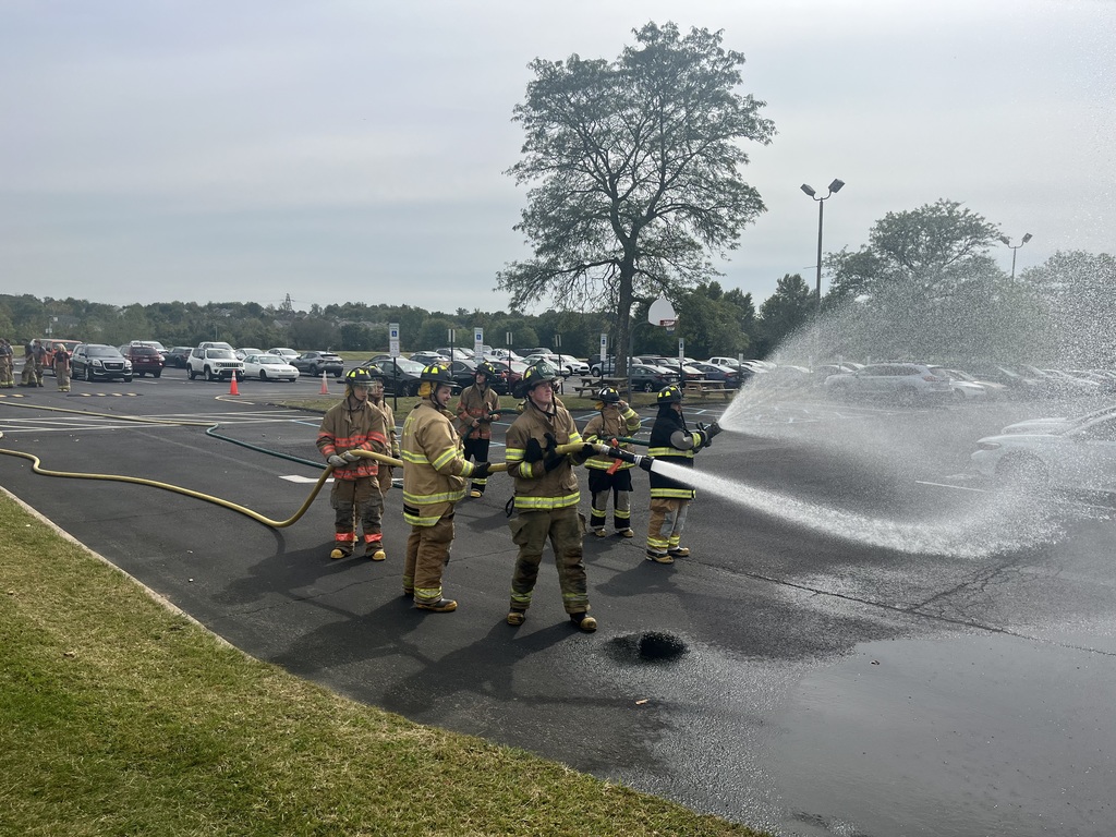 public safety students in their fire here using the fire