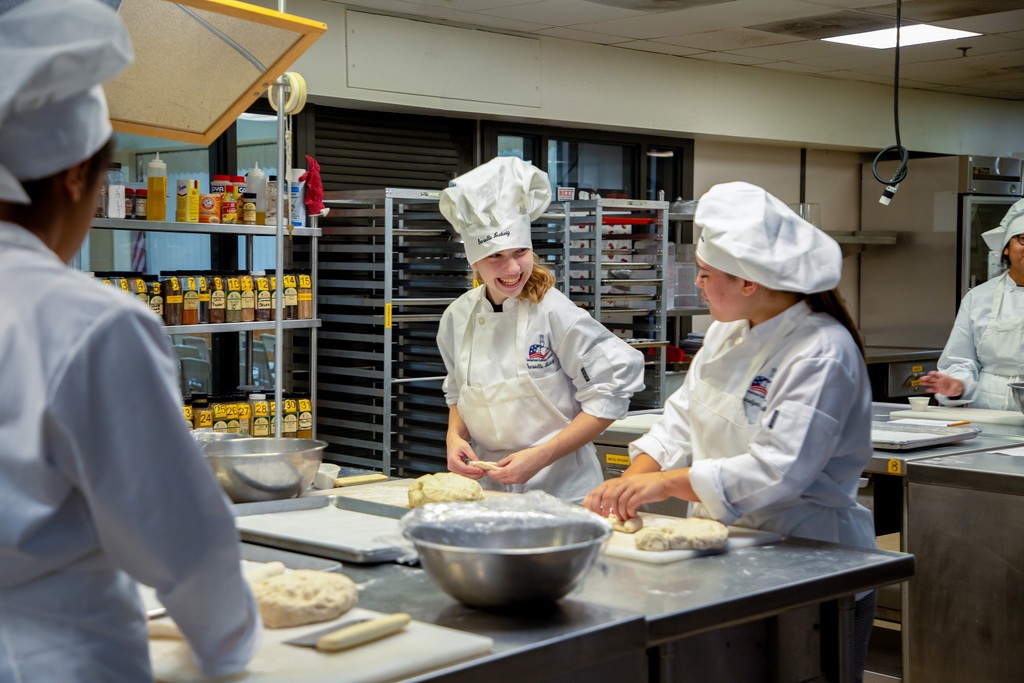 Culinary arts and science students working in their lab area And in their skills