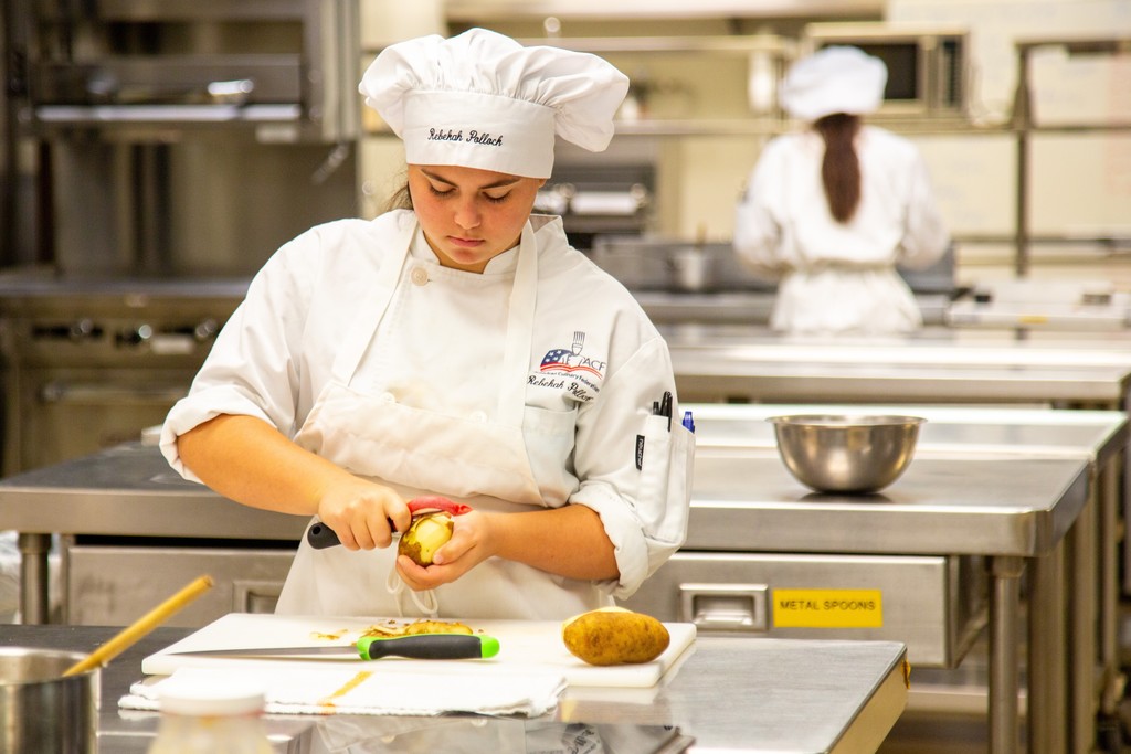 Culinary arts and science students working in their lab area And in their skills
