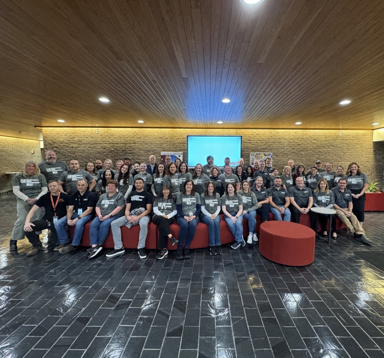 Group photo of all the students in the support MBT supports our veterans T-shirts