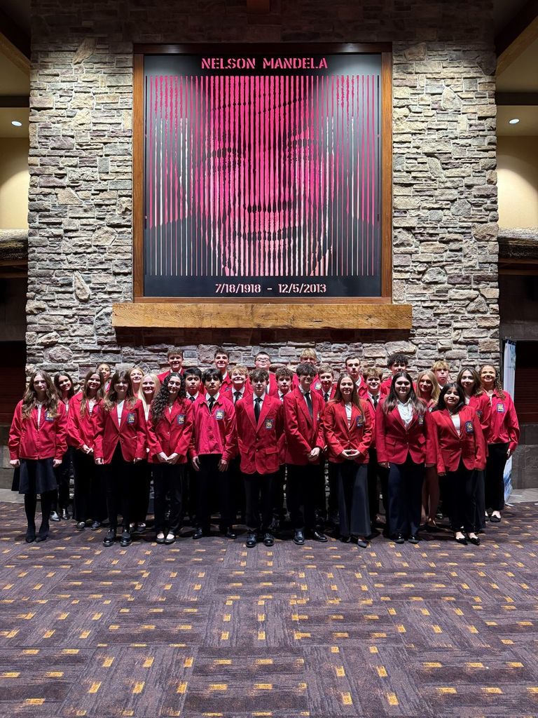photo of all of the skills USA students in their red jackets in the lobby of kalahari