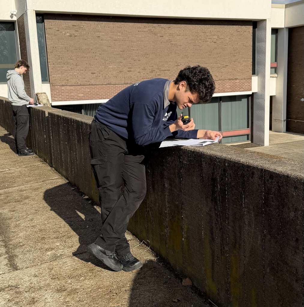 Public safety student working with communication device