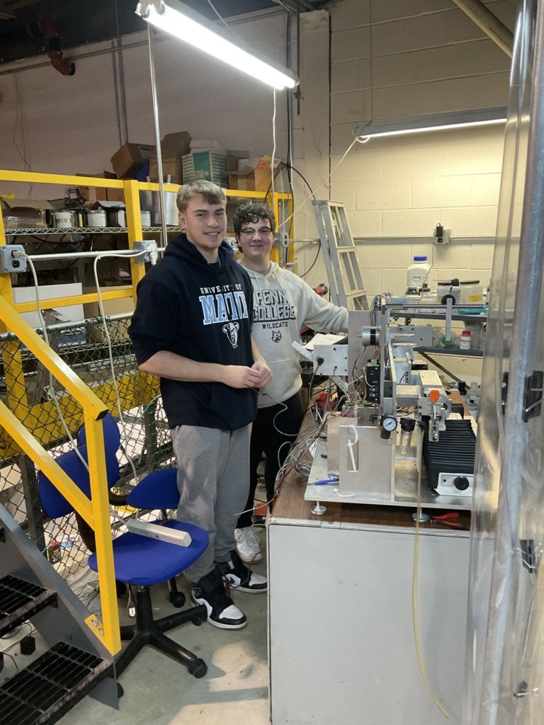 Vincent and Jack, they're in the lab area, the smiles on the basis that's my shirts on, they're working on a piece of equipment.