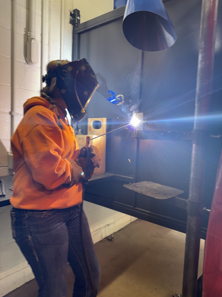 So welding student and orange sweatshirt welding