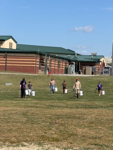 Students picking up trash.