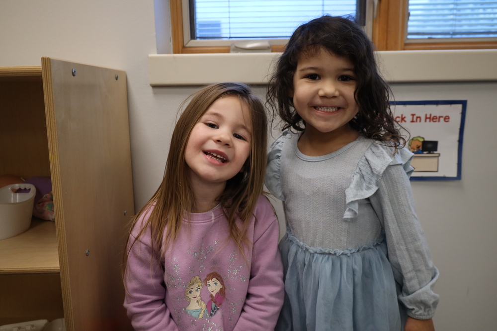 Two students smiling