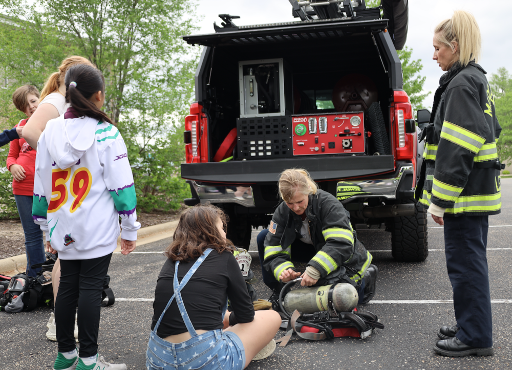 firefighters demonstrating gear 