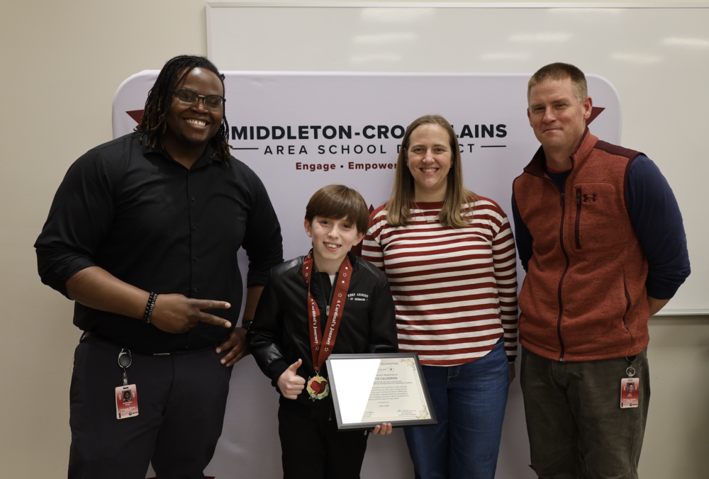 Kromrey Middle School Principal Dom Ricks, student Martin Ortiz Calderon, and Associate Principals Joanna Cree and Eric Engel