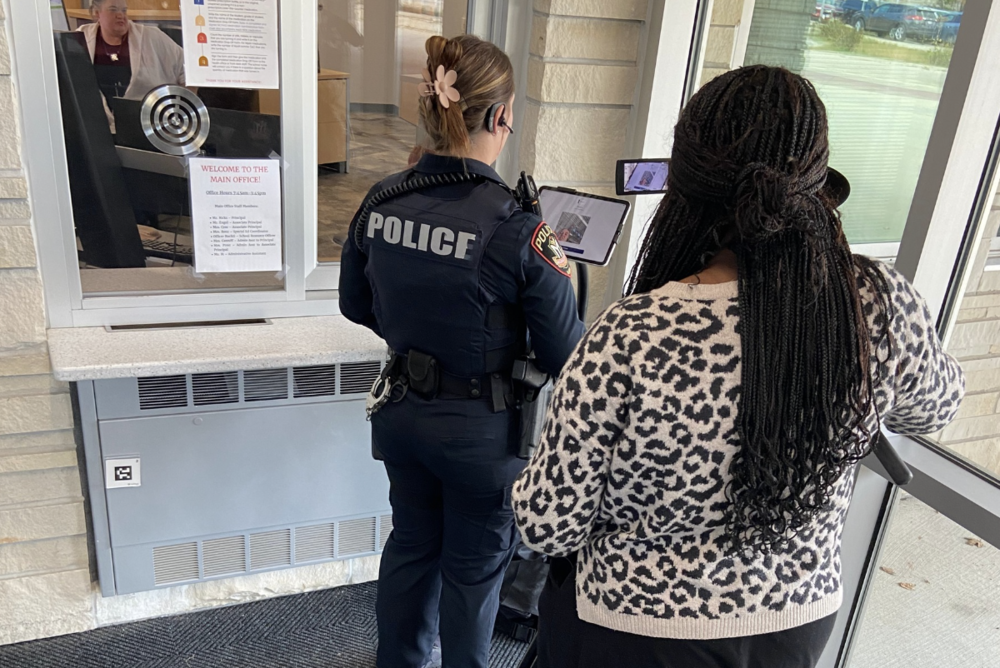 Two women using Visitor Aware software