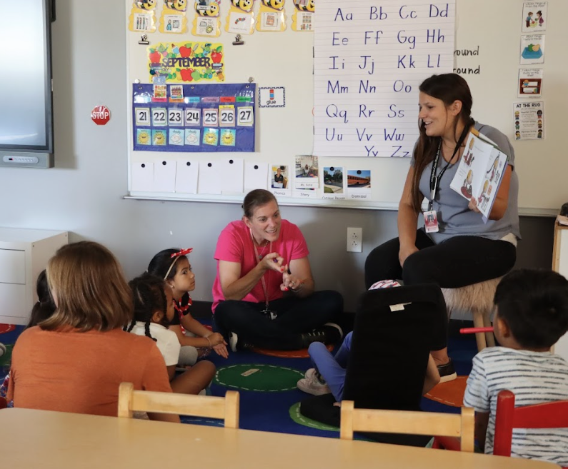Katie Kavanaugh reads a book to MCPASD 4K students while educators listen