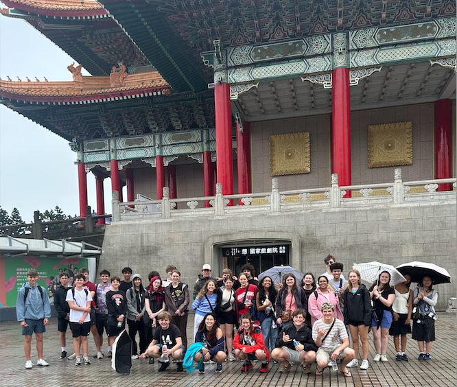 students stand in front of building in taiwan