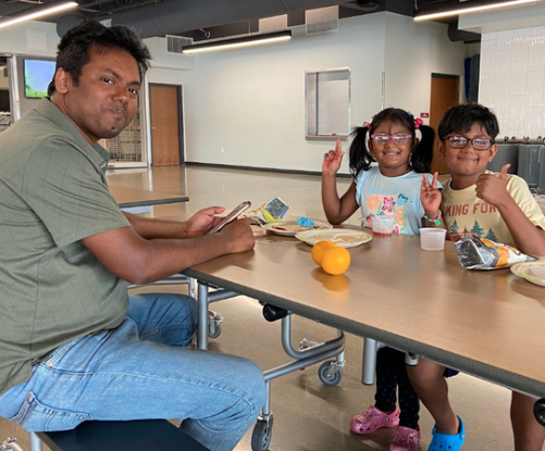 students eating at free summer meals program at middleton high school