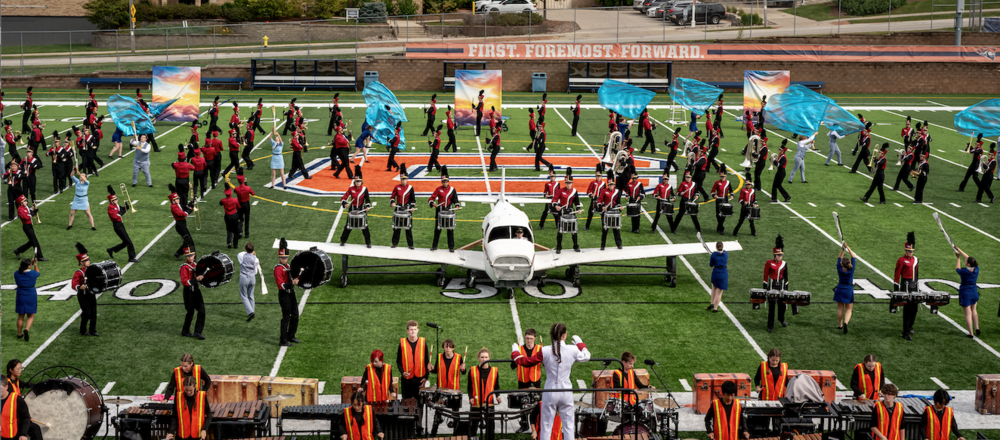 mhs marching band and color guard performing