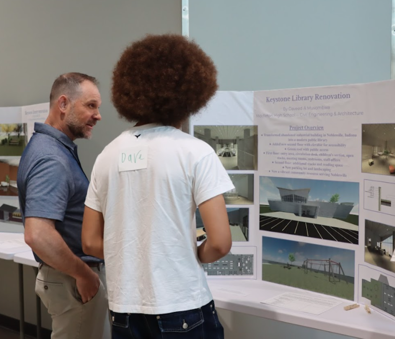 Matt Eaton talks with a student
