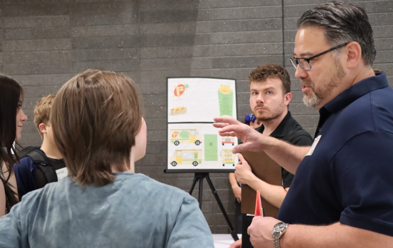 Alex Vernon and Michael Tsuchihashi talk with students