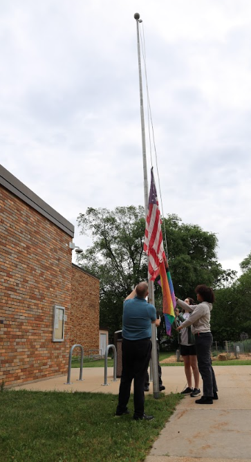 raising the Pride flag