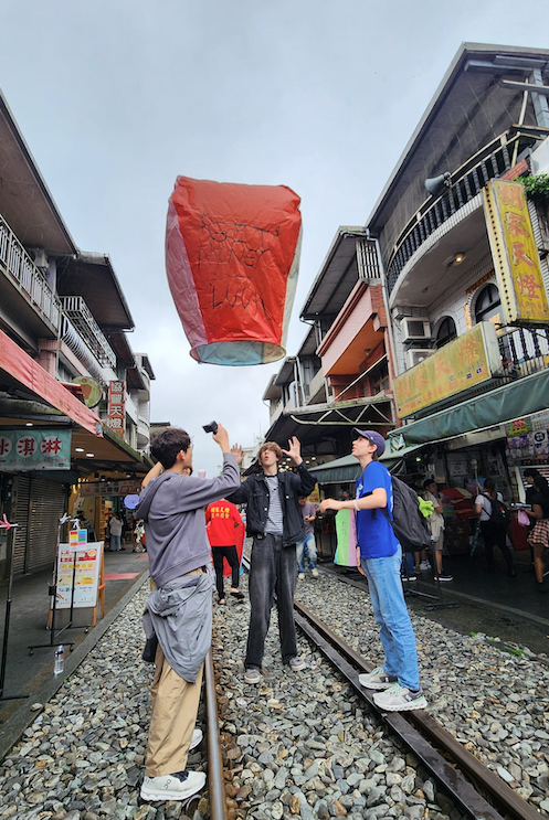 students lighting lantern