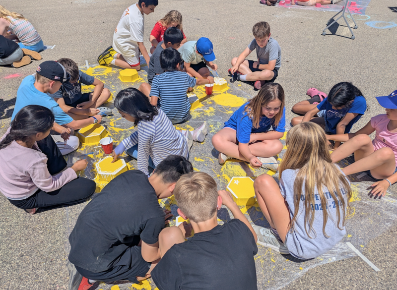 Students painting bricks