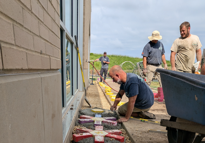 Carrington staff working on art installation