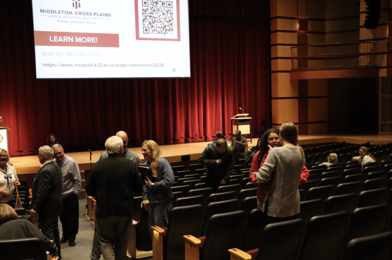 Community members talking after a referendum presentation