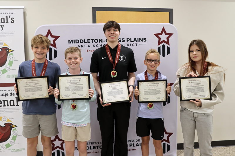 Five students smiling and holding their Cardinal's Journey Awards