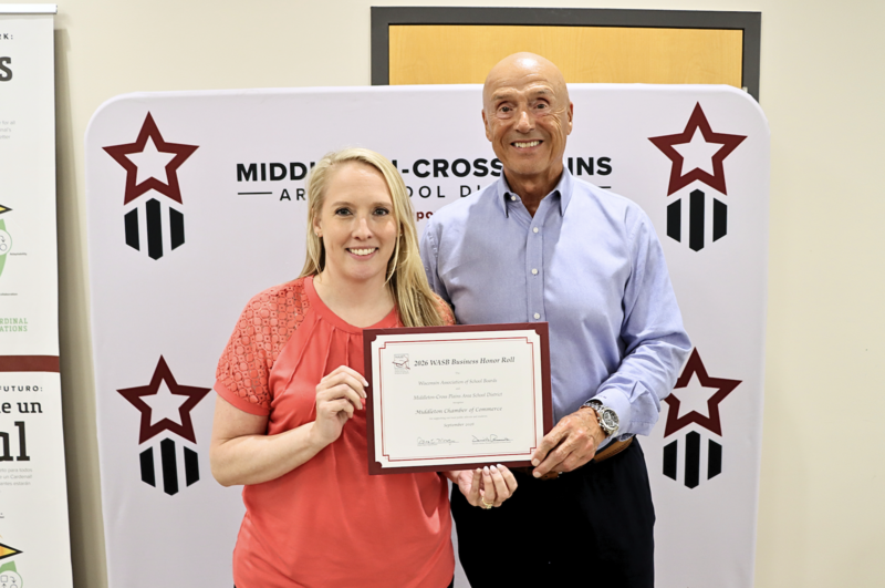 Kristen Parent and Terry Murawski smiling and holding WASB certificate