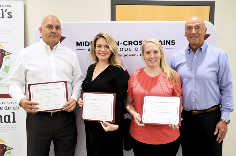 Four WASB Honor Roll recipients smiling and holding certificates
