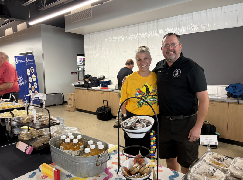 Nutrition Services Supervisor David Montag smiling with guests during food show