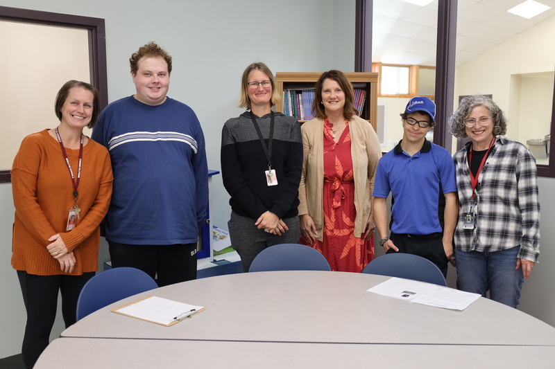 Dr. Monogue with Cardinal Academy students and educators