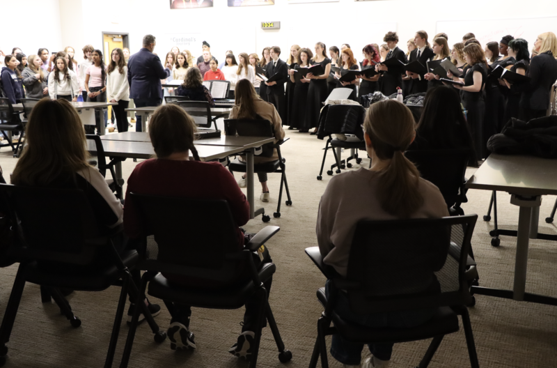 Staff listen to the Kromrey Middle School and Middleton High School choirs perform during a concert