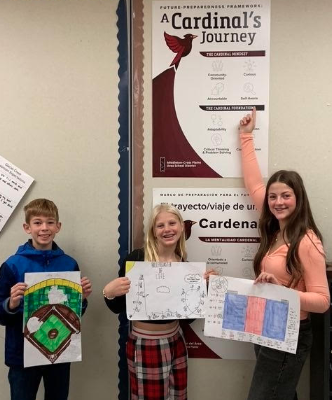 students with a cardinal's journey sign